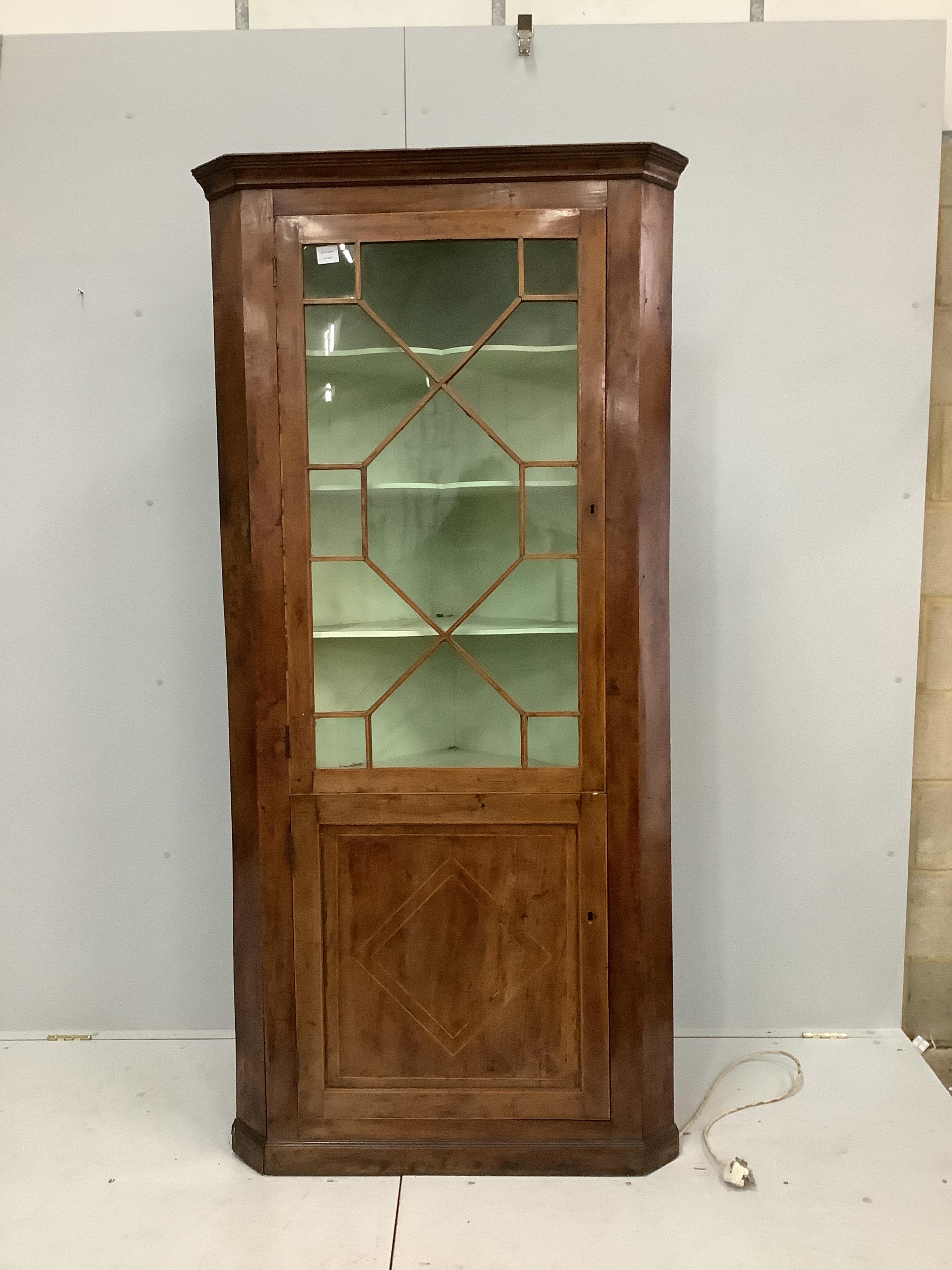 A George III mahogany standing corner cupboard, width 93cm, depth 50cm, height 198cm